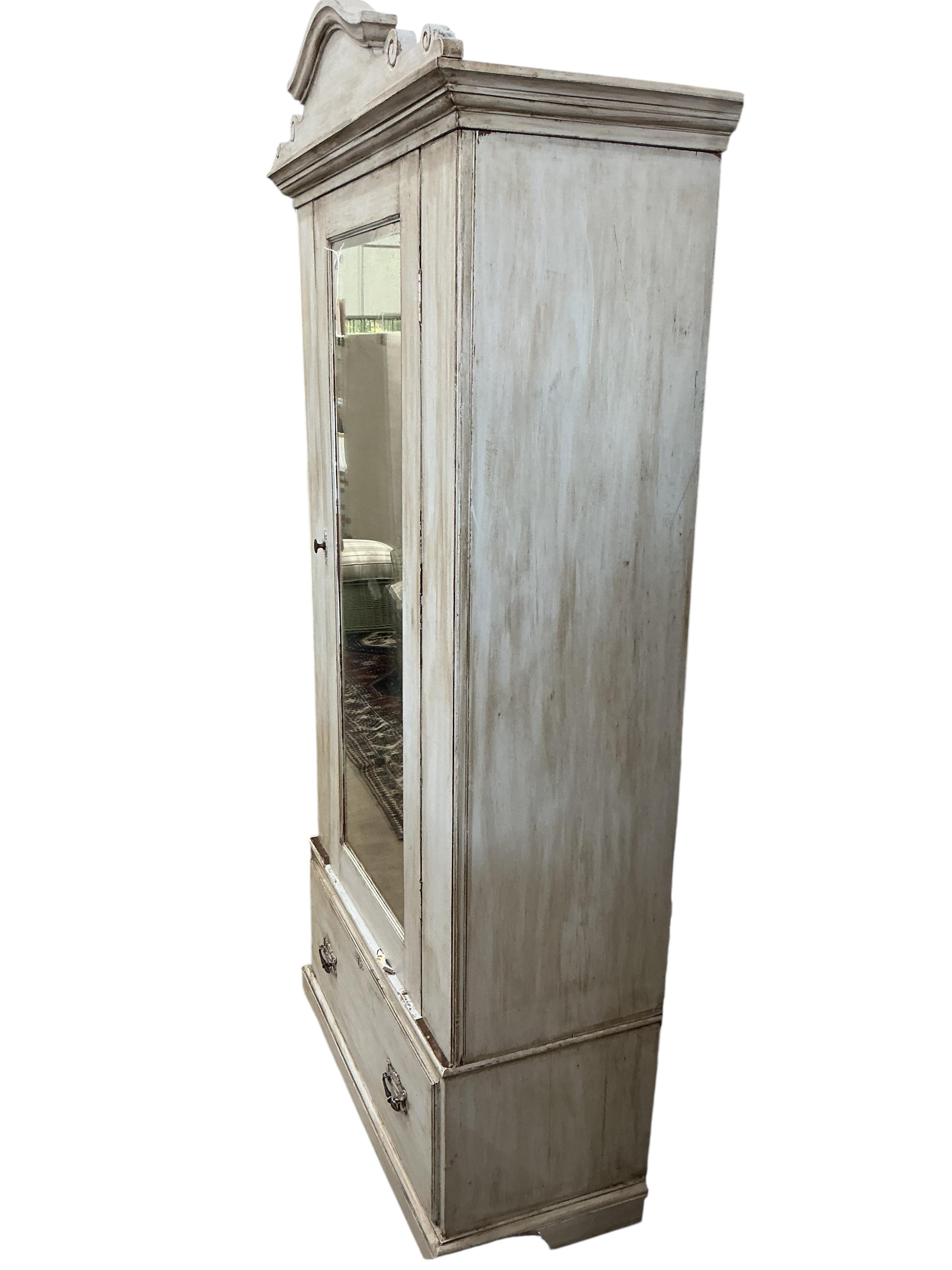 A wardrobe, later painted, width 112cm, depth 61cm, height 228cm